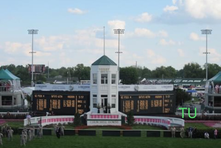 The tote board is dressed up pink for the Kentucky Oaks.